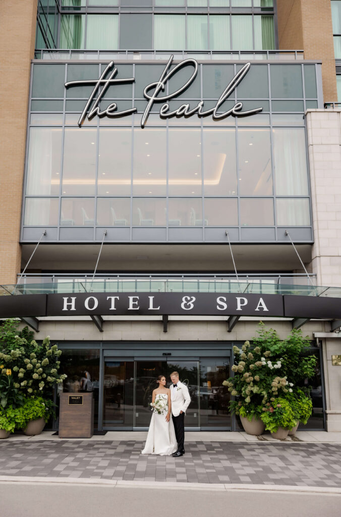 Couple outside of their wedding at the Pearle Hotel