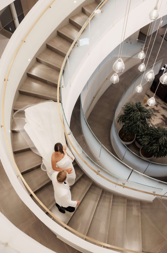 Couple on the stairs at their wedding at The Pearle Hotel